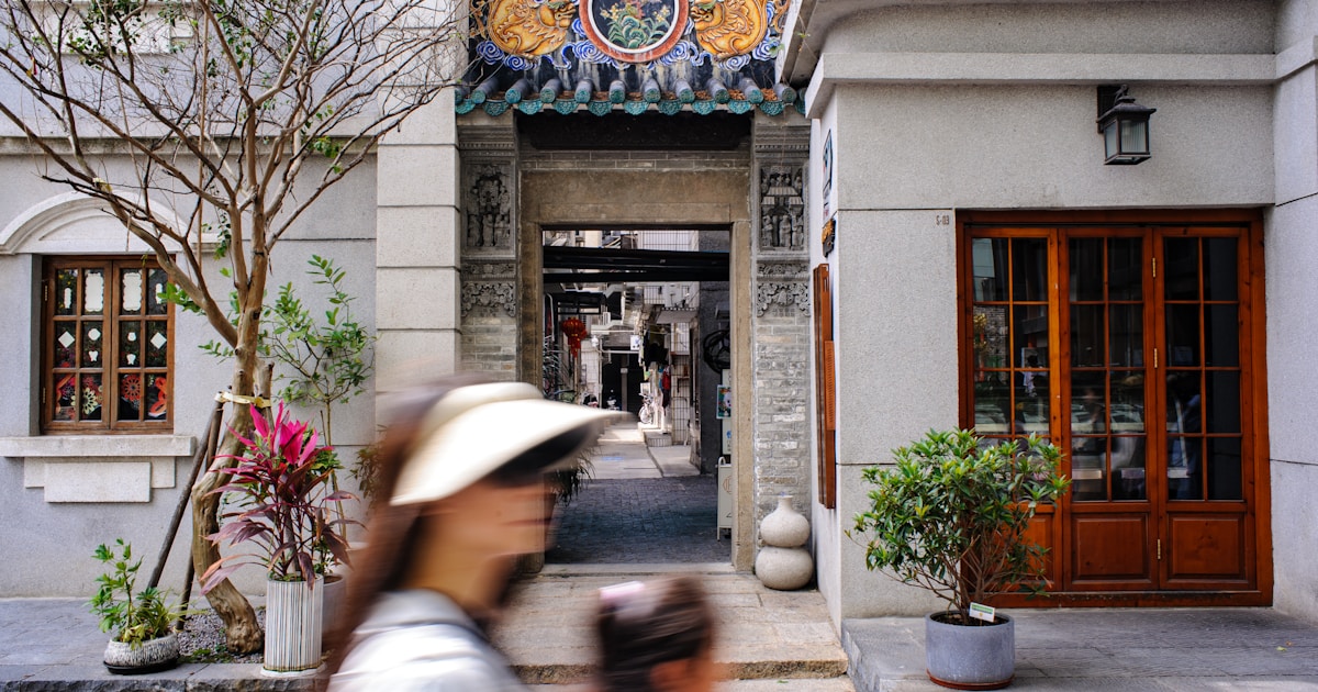 a woman and a child walking down a street