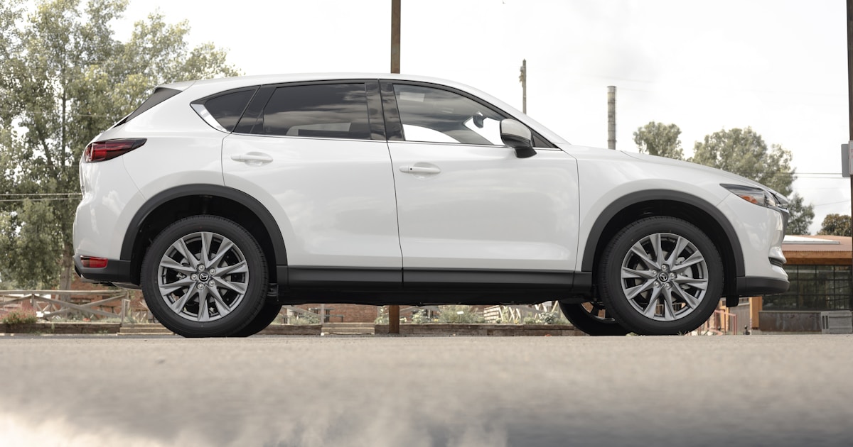a white mazda cx - 5 parked in a parking lot