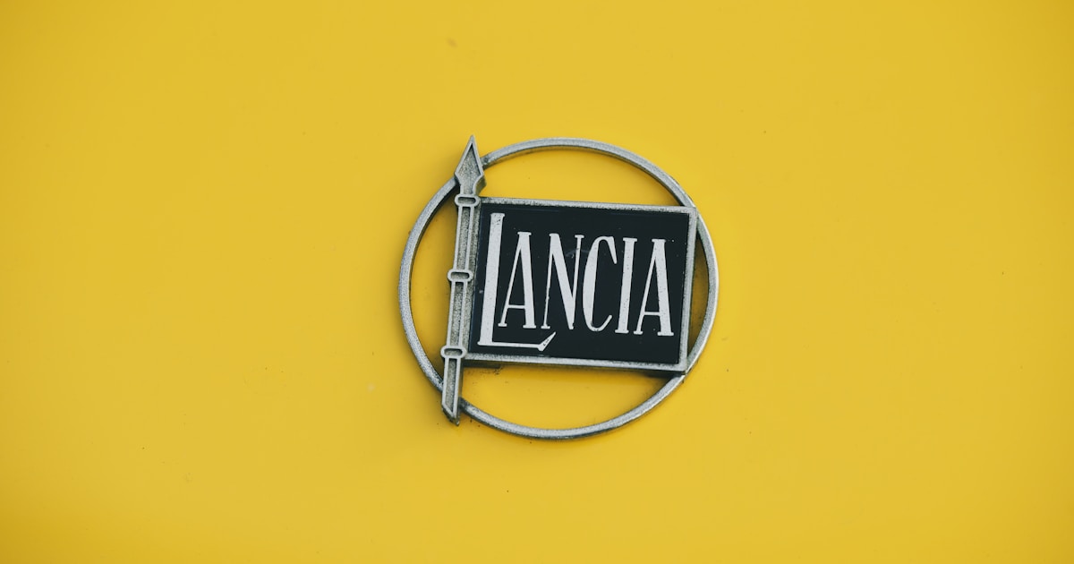 Lancia logo on a yellow background