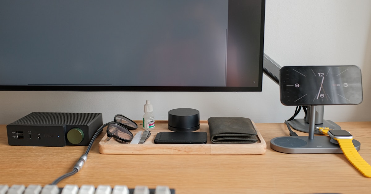A computer desk with a keyboard, mouse and monitor