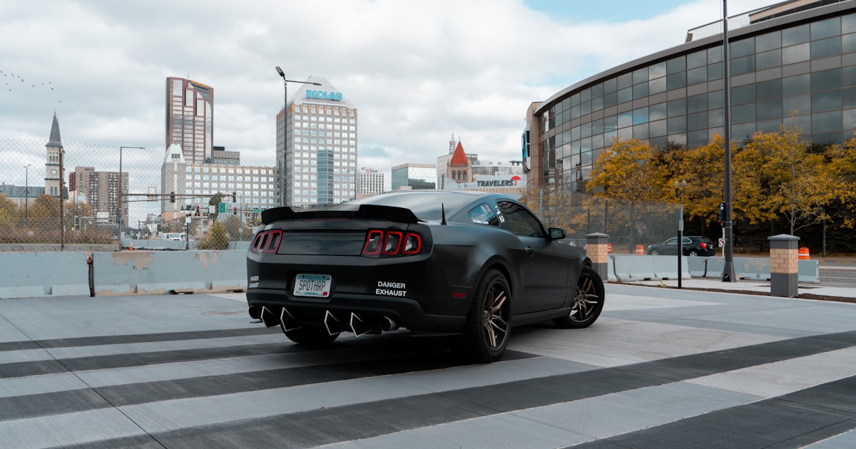 a black sports car parked on a city street