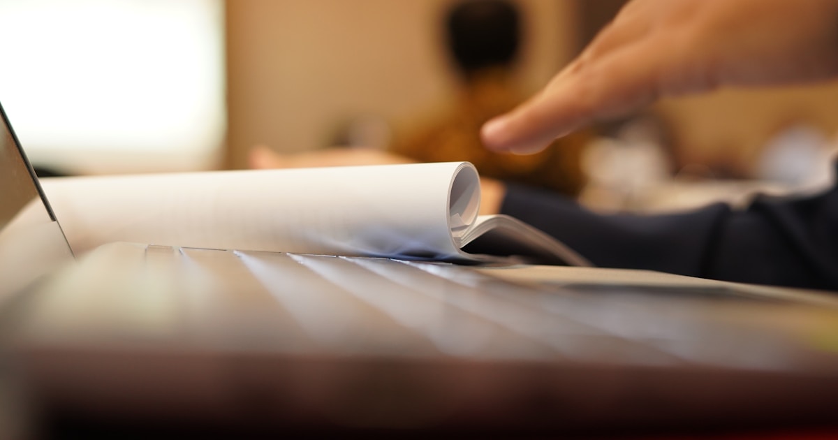 a close-up of a person reading a book