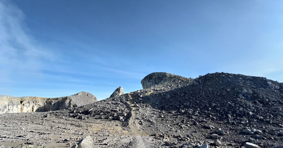 a rocky area with a blue sky