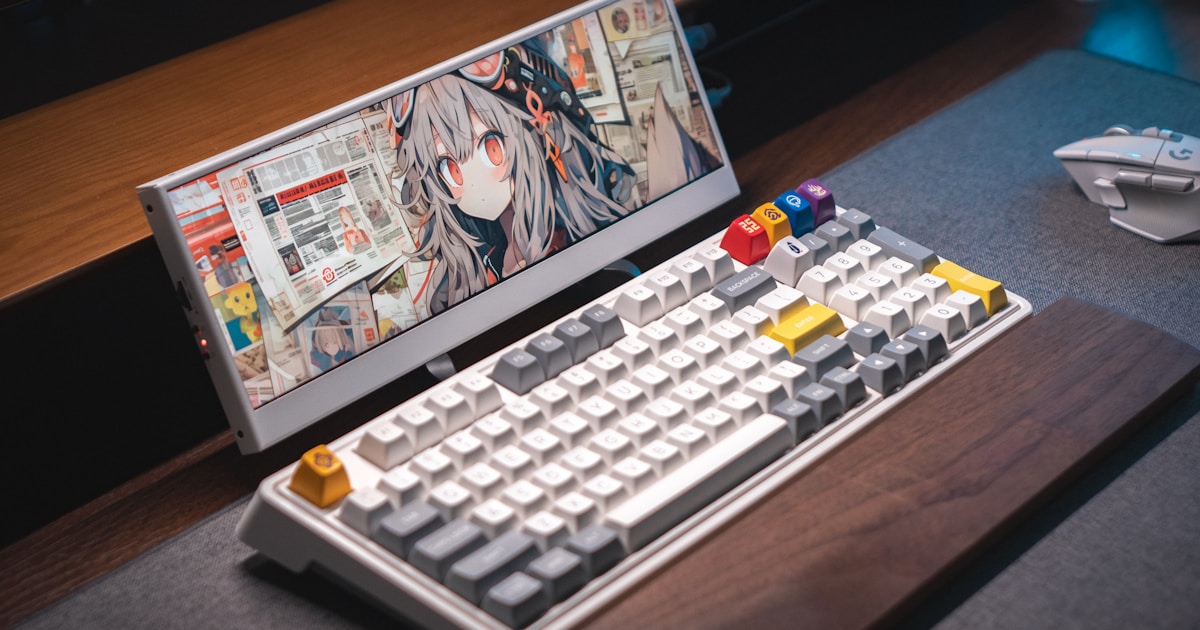 A laptop computer sitting on top of a wooden desk
