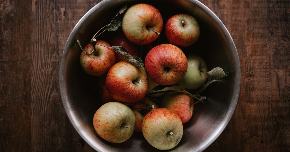 red apples on stainless steel bowl